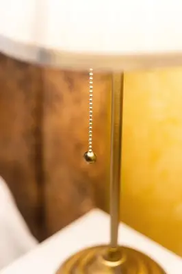 a close up of a lampost with a dropper on it at Almada Downtown Apartment by DA'HOME in Porto
