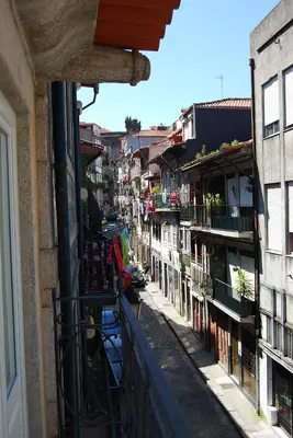 a view from a balcony of a street with buildings at Casa Dos Caldeireiros in Porto