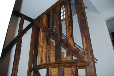 a wooden frame of a door in a room at Casa Dos Caldeireiros in Porto