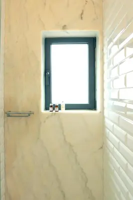 a bathroom with a window and a shower at Villa Invicta II in Porto