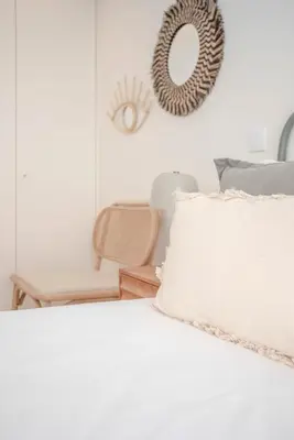a bedroom with a bed with a pillow and a mirror at Liiiving in Porto - City Design Apartments in Porto
