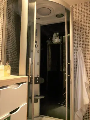 a bathroom with a shower with a glass door at Porto Downtown Taipas in Porto