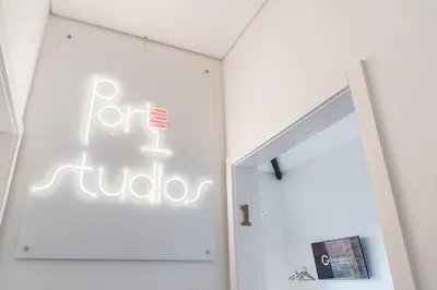 a white room with a sign on the wall at GuestReady - Port Studio 2 in Vila Nova de Gaia