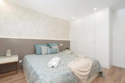a bedroom with a bed with two stuffed animals on it at Host Wise - Bright & Contemporary Flat - Ace Location in Porto