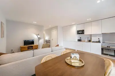 a living room with a couch and a table at Nomad's Sunny Firmeza - 2BED Porto in Porto