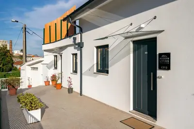 a white building with a door on the side of it at WHome Riverside View Premium Apartment w/ AC & Terrace in Porto