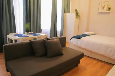 a living room with a couch and a bed at Bonsai Apartment II in Porto