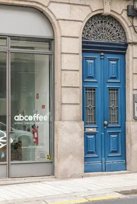 a blue door on the side of a building at Duque Oporto Apartment in Porto