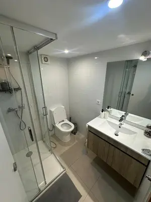 a bathroom with a shower and a toilet and a sink at Five House 14A in Porto
