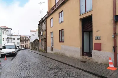 an empty street with a white van parked next to a building at Douro by your side with Pool in Vila Nova de Gaia