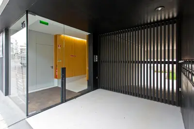 a hallway with a yellow door in a building at Balconies of Cedofeita & Garage in Porto