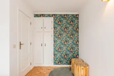 a bedroom with a bed and a brick wall at São Bento Deluxe 42 with Balcony in Porto