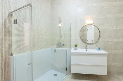 a bathroom with a sink and a tub at São Bento Deluxe 42 with Balcony in Porto