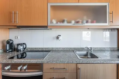 a kitchen with a sink and a counter top at GuestReady - Warwick avenue in Lapa in Porto
