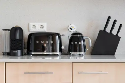a kitchen counter with two coffee pots and pans at GuestReady - Antas Studio in Porto