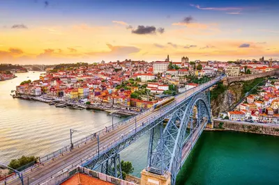 a bridge over a river with a city at N&N Home in Porto