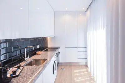 a kitchen with a sink and a counter top at Oporto lovely house deluxe in Porto