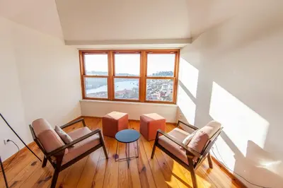 a room with chairs and a large window at Citybreak-apartments Douro View in Porto