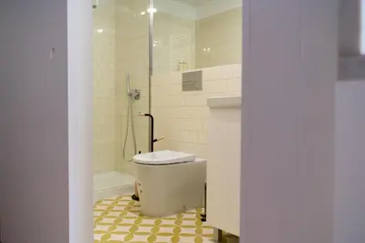 a bathroom with a toilet and a shower at Sky de Loios in Porto