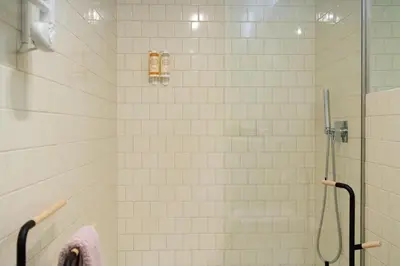 a bathroom with a shower with a glass door at Sky de Loios in Porto