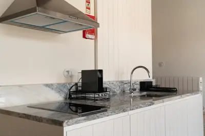 a kitchen with a counter top with a sink at Sky de Loios in Porto