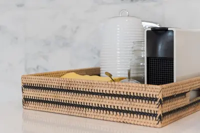 a basket of food on a counter with a charger at GuestReady - Chakra Duplex in Porto