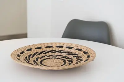 a round rug sitting on top of a white table at GuestReady - Porto by the Bridge in Vila Nova de Gaia