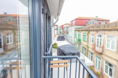 a balcony with a view of a city street at 12 Sweet Caroline in Porto