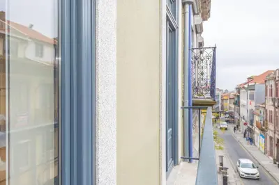a window with a view of a city street at 12 Sweet Caroline in Porto