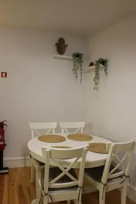 a white table and chairs in a room at Oporto Apartment Sé Catedral in Porto