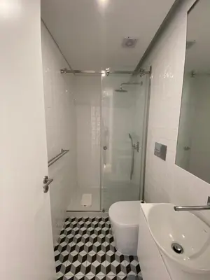a bathroom with a shower and a toilet and a sink at OHH - General da Silveira Flat Deluxe Apartment - Downtown in Porto
