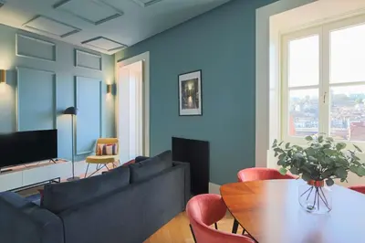 a living room with a couch and a table at HM - Infante Riverside Apartment K in Porto