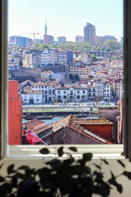 a view of a city from a window at HM - Infante Riverside Apartment K in Porto