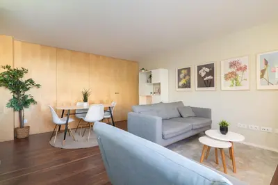 a living room with a couch and a table at Host Wise - Restful Minimalist Flat - Balcony in Porto