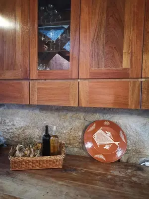 a counter with a basket of wine bottles and cabinets at Vérités Dame in Porto