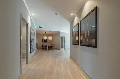 a hallway with paintings on the walls of a building at River Eyes Suites in Vila Nova de Gaia