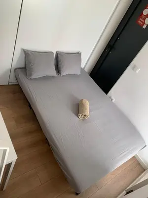 a bed in a room with a small bedvisor at FIVE HOUSE 16 in Porto