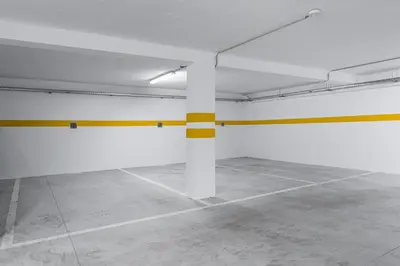 an empty room with a yellow and white pole at GuestReady - Poet's Modern Retreat in Porto