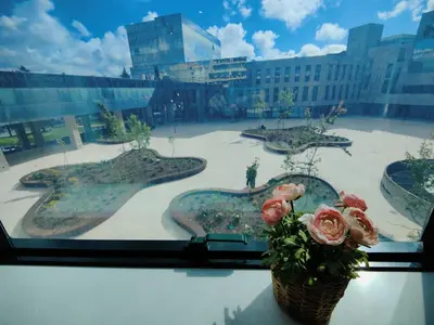 a view of a courtyard from a window with flowers at A Window to Porto – Premium Apartment Porto Downtown in Porto