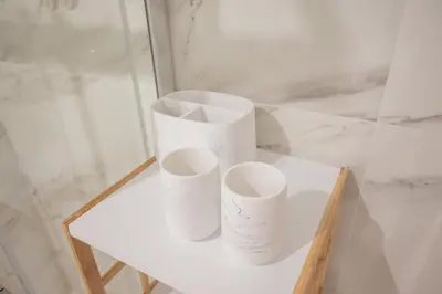 three rolls of toilet paper sitting on a table at Cocoon Almada in Porto