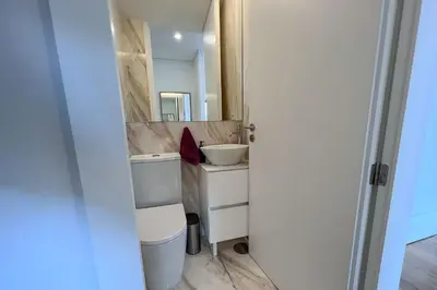 a bathroom with a sink and a mirror at Spacious Studio w/ Balcony & AC by LovelyStay in Porto