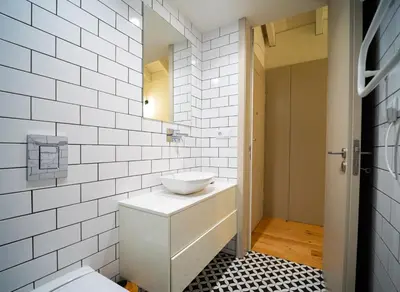 a white bathroom with a sink and a toilet at OportoCityView - Trindade Almada in Porto