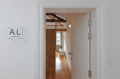 a hallway with a door leading into a room at FLH Porto Santa Catarina Duplex in Porto