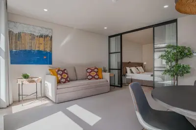 a living room with a couch and a table at Urban Luxury Apartment, Downtown Porto near Metro in Porto