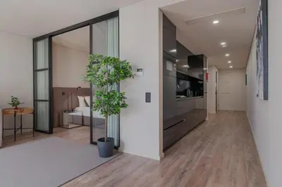a hallway of an office building with a potted plant at Urban Luxury Apartment, Downtown Porto near Metro in Porto