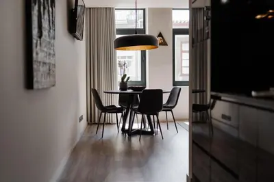 a dining room with a table and chairs at Urban Luxury Apartment, Downtown Porto near Metro in Porto