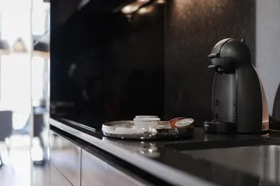 a coffee maker sitting on a counter in a kitchen at Urban Luxury Apartment, Downtown Porto near Metro in Porto