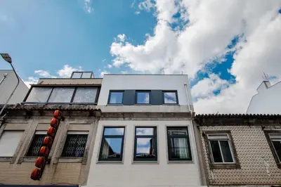 a building with windows on top of it at Urban Luxury Apartment, Downtown Porto near Metro in Porto