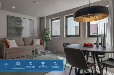 a living room with a table and a couch at City Luxury Apartment, Downtown Porto near Metro in Porto