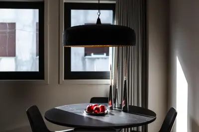 a black table with a bowl of fruit on it at City Luxury Apartment, Downtown Porto near Metro in Porto